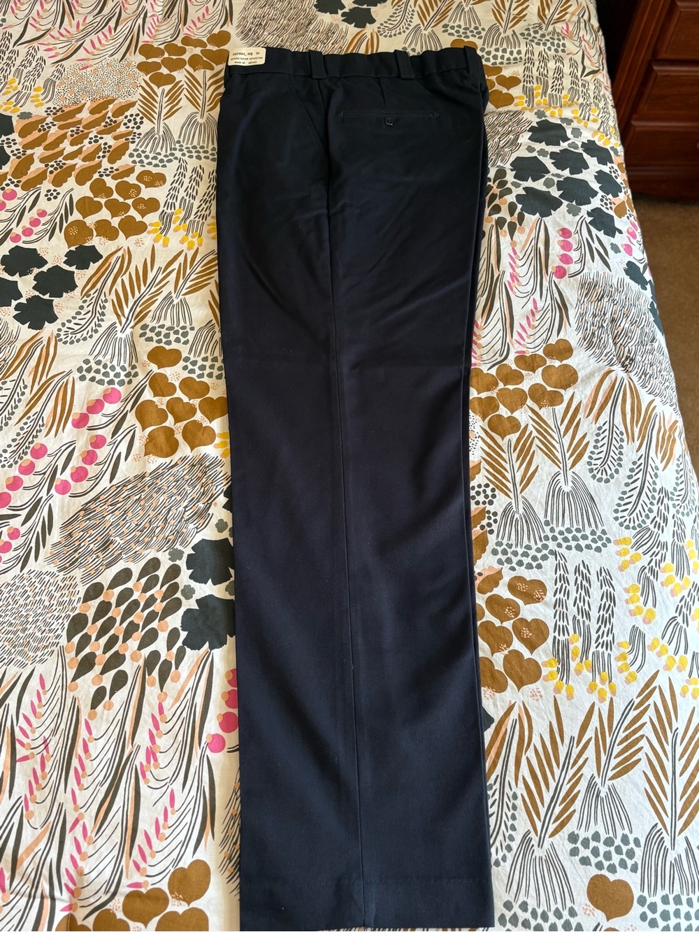 Men’s black slacks, size 38 waist, 34 inseam, 85% polyester, 35% cotton, NWT